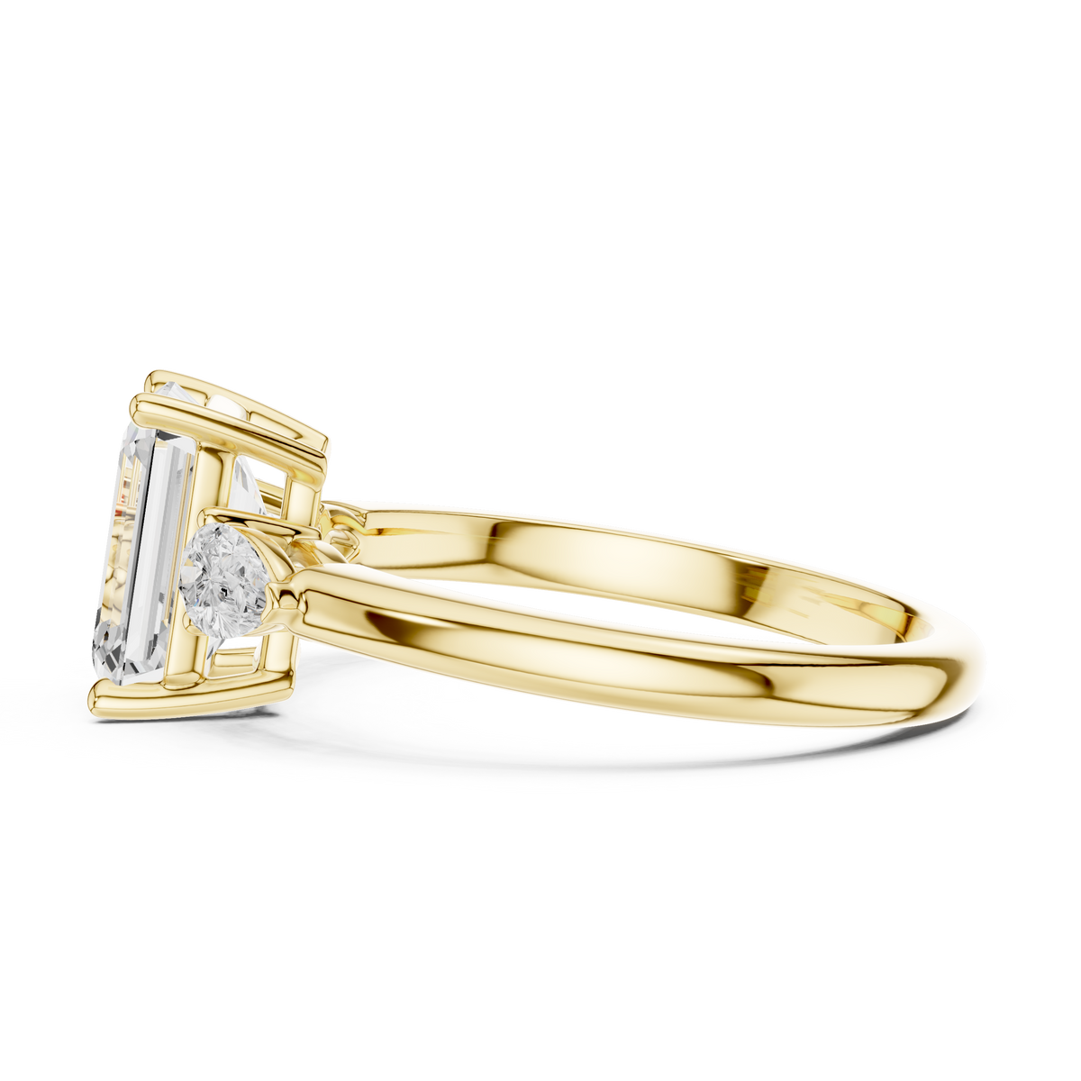 Angled hero view of an elegant 3-stone emerald cut diamond ring resting on white backdrop displaying light symmetry across center and pear cut side stones.