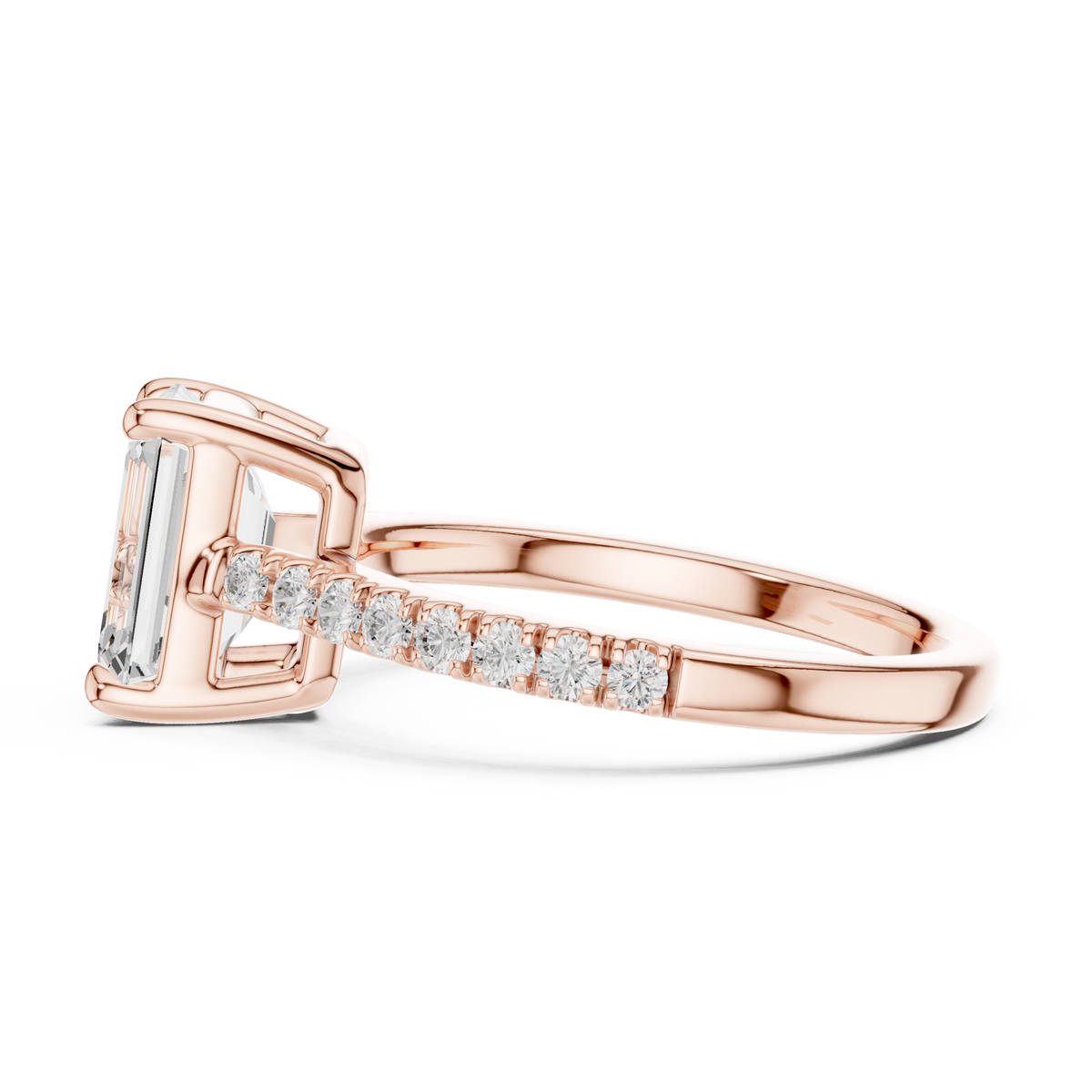 Angled perspective shot showcasing the brilliance of the 2.00 carat emerald cut lab grown diamond paired with 16 round brilliant accent diamonds embedded on a sleek 2.00mm wide shank, perfect for eco friendly wedding ring shoppers on Google and Pinterest.