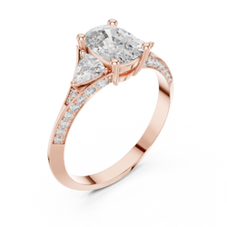 A side profile angle showing the elevated collet setting of a cushion cut lab grown diamond ring in 18K white gold with detailed trillion accent settings and delicate pave micro diamonds along the shank, highlighting precision craftsmanship and brilliant light reflections.

