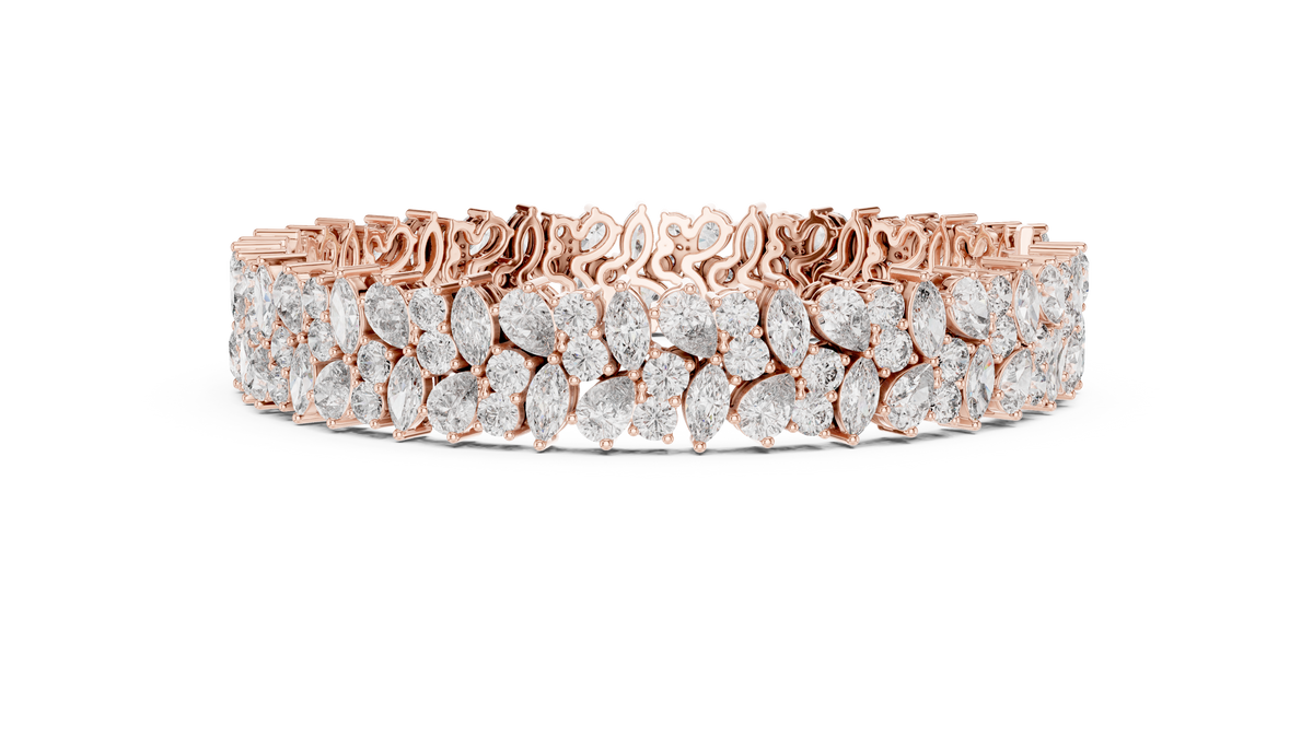Angle 2 Close Up Profile View highlighting collet bezel setting details of Pear and Marquise lab grown diamonds set in solid 14k gold bracelet band