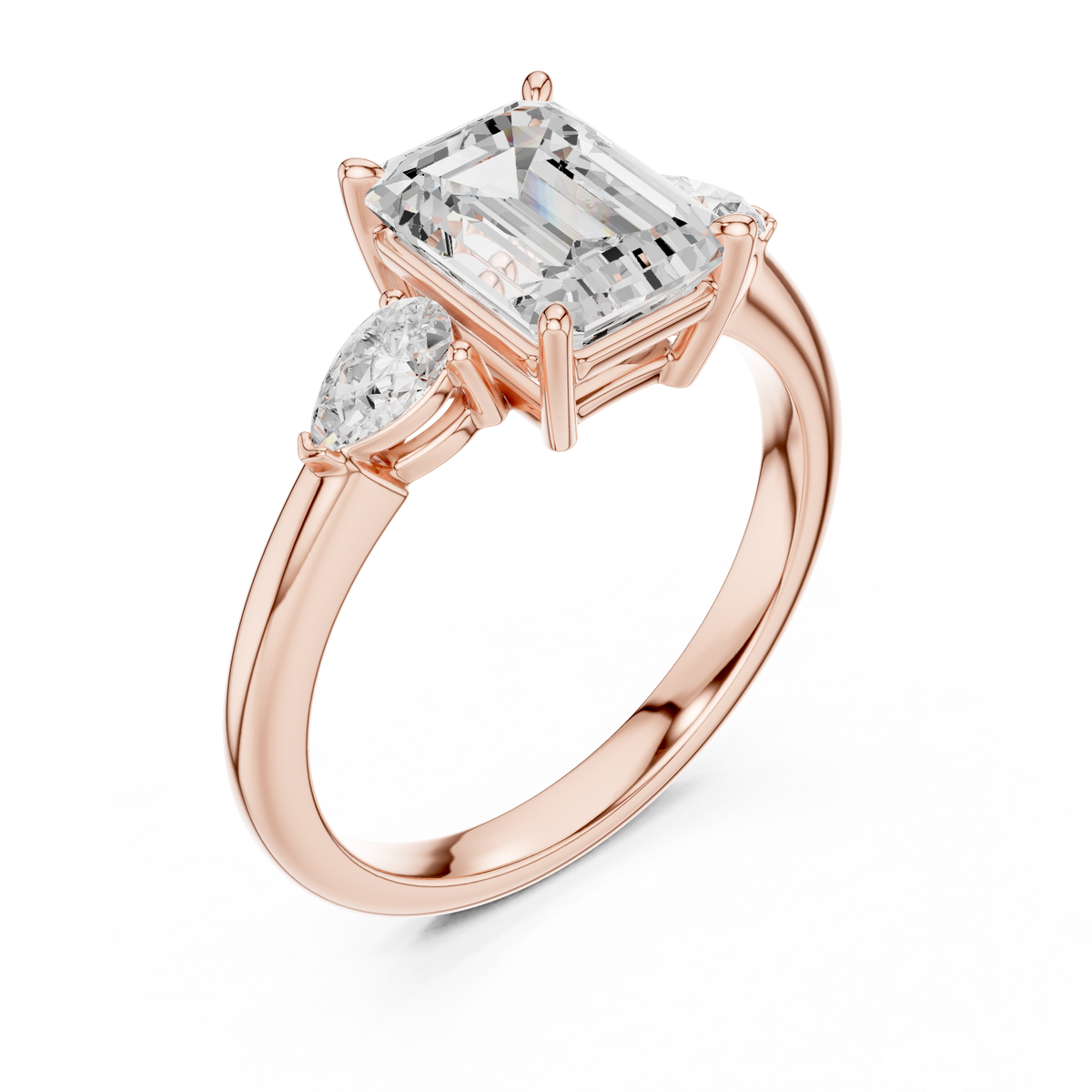 Angled side studio perspective showing the elevated 5.35mm crown height and intricate peg head design of a 14K Gold 3 Stone Emerald Cut Lab Grown Diamond Ring with smooth high polish finish.