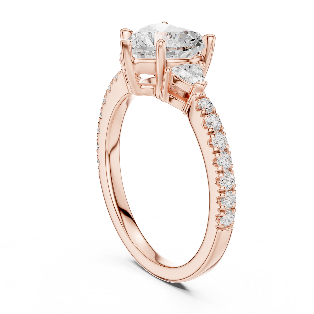 Close up perspective of 18k solid gold heart cut diamond ring on hand model highlighting light reflection across heart center stone and trillion accent diamonds, suitable for heart promise ring and romantic holiday gifts.