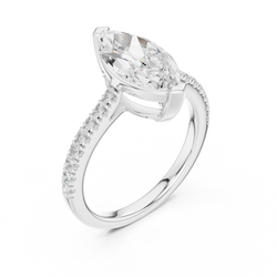 Direct sunlight view of the marquise cut lab diamond to show the natural fire and sparkle intensity of the high quality stone against the warm 14k gold metal aesthetic