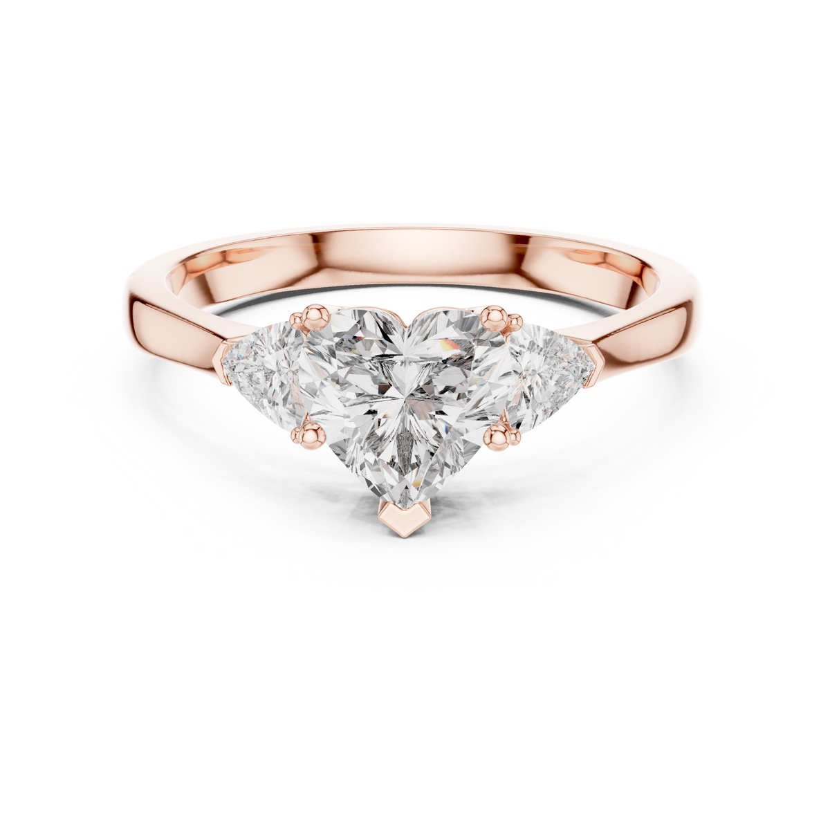 Heart Diamond Ring in 14K Gold featuring a central 1 carat heart cut lab grown diamond flanked by two trillion side diamonds shown in a clean studio front view angle for Etsy engagement ring listings.

