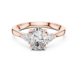 High resolution main studio view of a 14K Gold Lab Diamond Ring featuring a brilliant 1 carat oval cut center stone flanked by two trillion side diamonds in a classic three stone collet setting. Perfect eco friendly oval engagement ring for women shopping on Etsy.