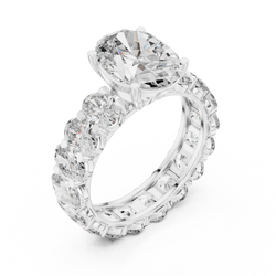 High resolution studio light reflection capture emphasizing the sparkle, fire, and scintillation of the oval cut lab grown diamonds on a solid 14K white gold band, offering sustainable eco friendly alternative luxury jewelry.


