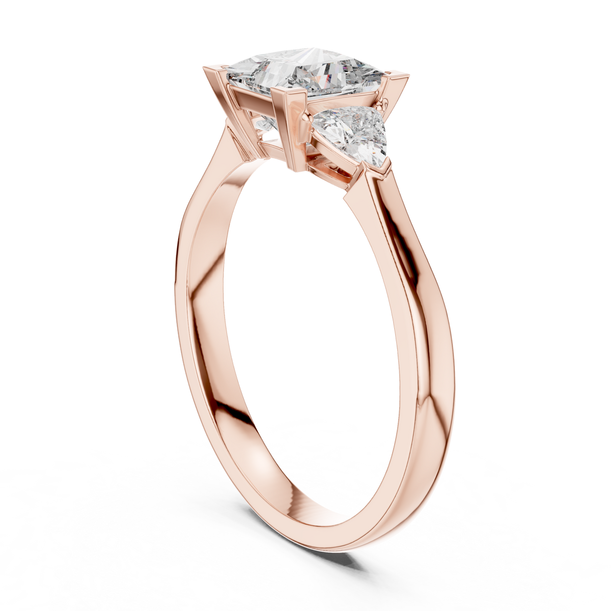 Low-angle perspective view of the Bridal Engagement Princess Cut Lab Grown Diamond Ring in rose gold, illustrating the elegant shank taper leading into the secure prong architecture of this trillion side stone diamond ring.