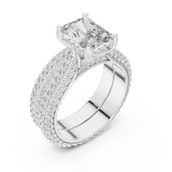 Macro close up detail of the under gallery basket showing hand set micro pave diamonds along the bridge and prongs, proving expert artisan craftsmanship by HB Prestige Jewels for high end custom engagement ring buyers.

