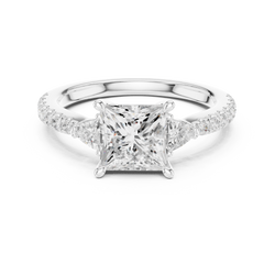 Macro close up view of a Lab Diamond Three Stone Engagement Ring highlighting the VVS1 clarity and EF color grade of the center princess cut lab grown diamond and precision pave set band polished in solid 14k gold by artisan jewellers at HB Prestige Jewels.