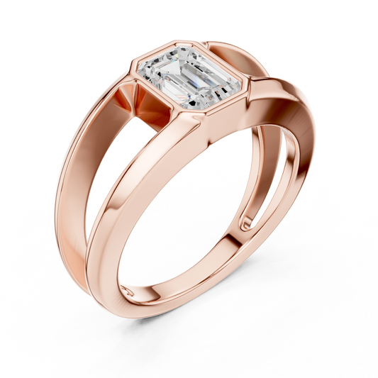 Architectural emerald cut diamond ring sculpted with bold split shank gold elegance.