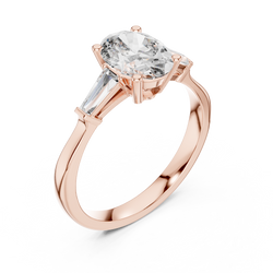 Side profile view highlighting the secure collet basket setting and smooth tapered shank design of this 18k solid gold oval diamond engagement ring with clear sparkling accent baguettes

