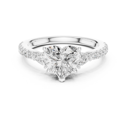 Studio lighting closeup of 1.50 carat heart lab diamond 3 stone ring highlighting top down table facet geometry and 14 pave set accent diamonds on band, tailored for luxury bridal jewelry lovers.