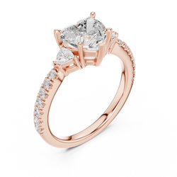 Three stone heart shape lab grown diamond ring viewed from side profile revealing cathedral architecture prong setting and pave diamond band design, crafted in solid 14k gold for women seeking unique handmade luxury engagement jewelry.

