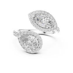 Top angle macro shot highlighting the contrast between the 8.5x5.5mm pear diamond and 10x5mm marquise diamond encircled by brilliant halo diamonds in solid 14K gold craftsmanship

