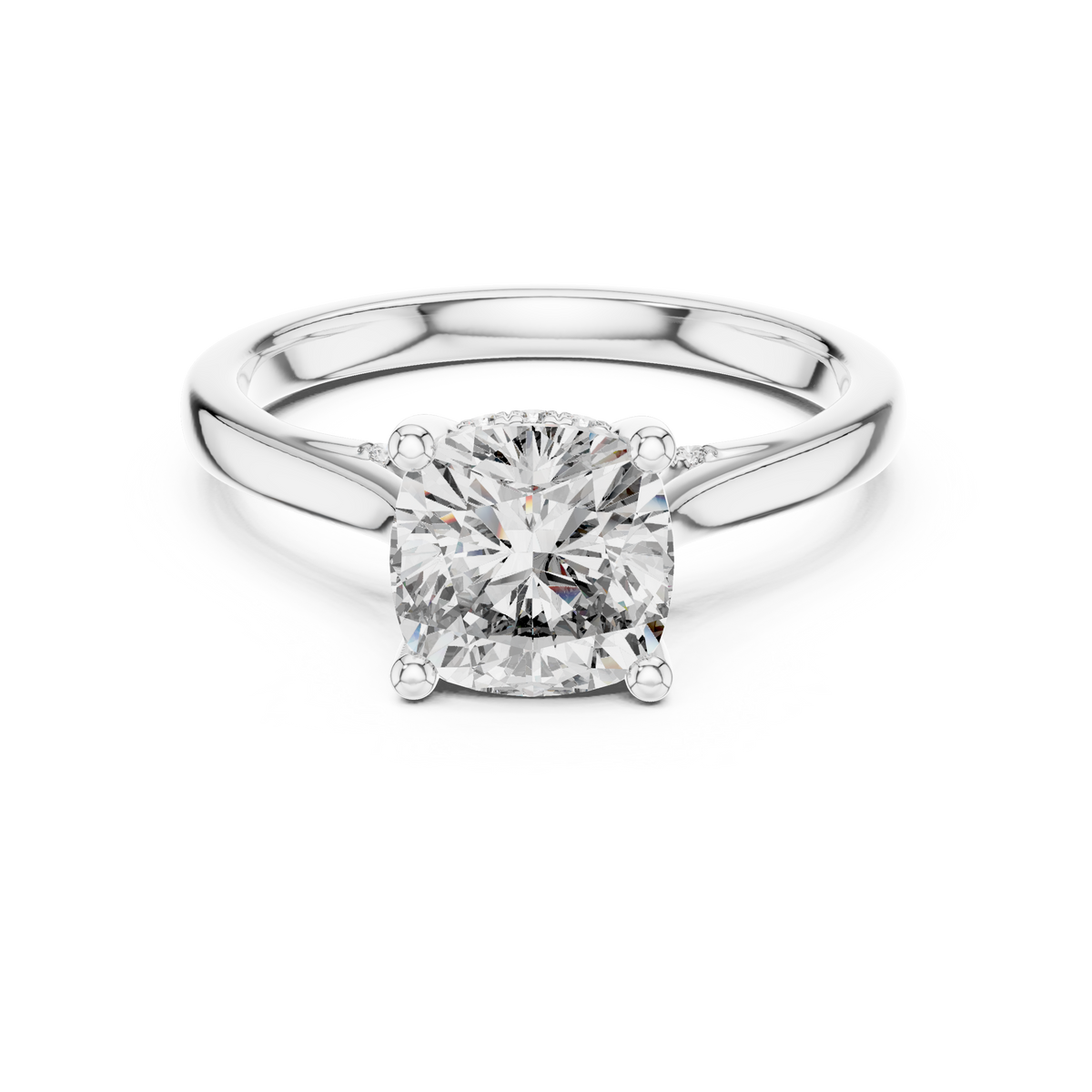 Top down aerial view displaying the perfectly cut cushion solitaire gem surrounded by smooth polished gold band and hidden bridge diamonds.

