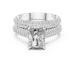 Top down flat lay photo of the radiant cut lab grown diamond solitaire ring resting gracefully on a white luxury velvet ring box, emphasizing the full pave shank structure and high polish finish of the fine gold mount.

