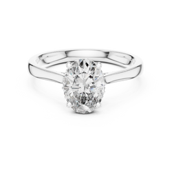 Top down top view revealing the symmetry and proportions of the oval brilliant cut center stone balanced by the sparkling round accent diamonds lining the under gallery collet ring


