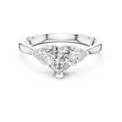 Top down visual perspective of the three stone heart diamond engagement ring emphasizing symmetry color clarity and brilliant craftmanship in solid 14k gold.

