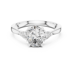 Under gallery detail shot showcasing the comfortable tapered shank design, structural prongs, and internal metal stamp on this handmade 14K solid gold three stone diamond engagement ring.