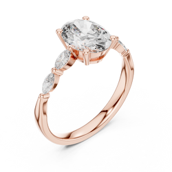 side profile of the 14K gold three stone ring showing the collet setting and the elegant tapered shank design capturing the fine craftsmanship

